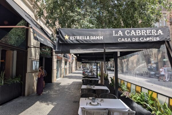The awning and pavement terrace at La Cabrera Casa de Carnes on Carrer de la Diputacio in the Eixample, Barcelona.