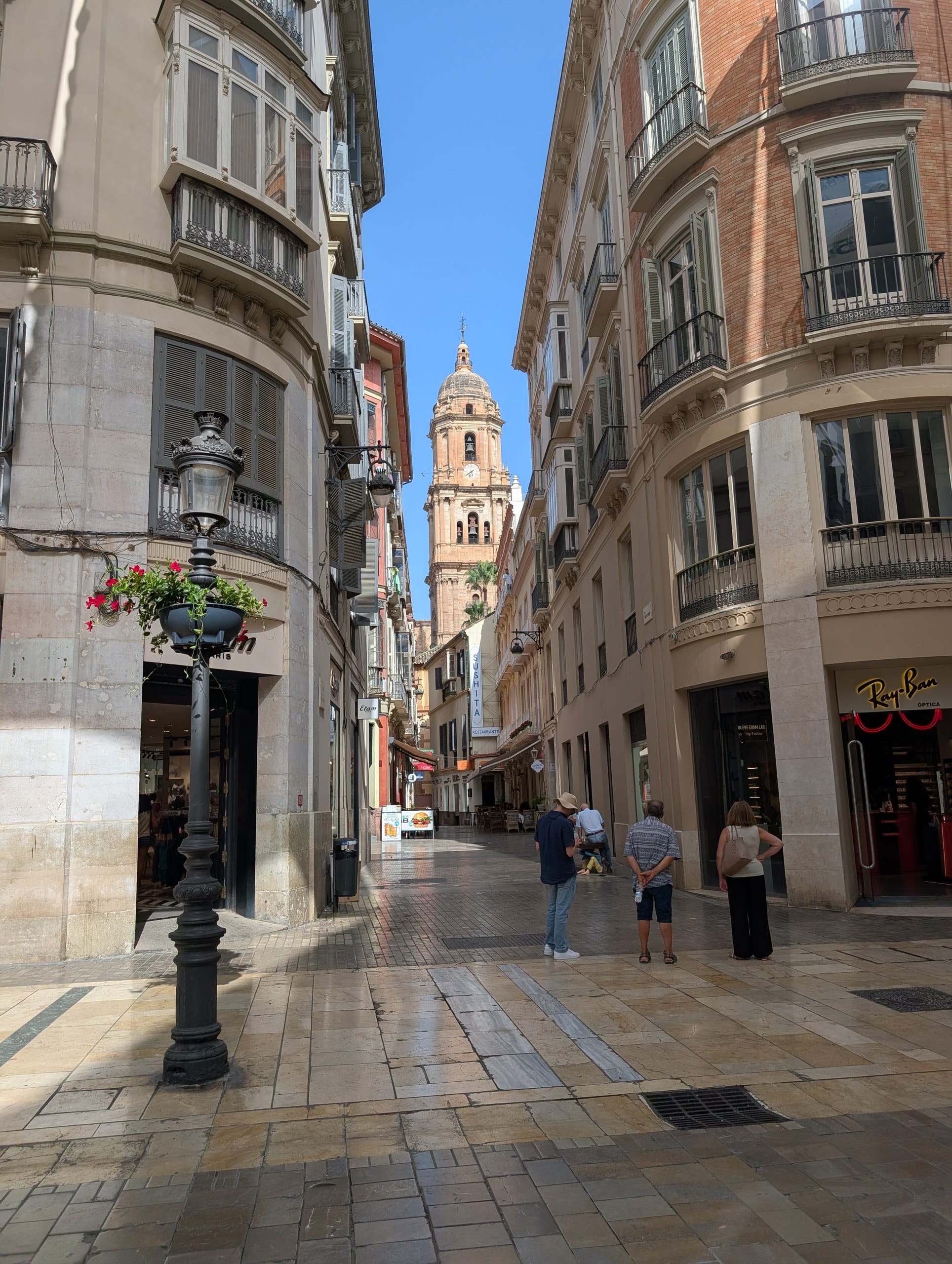 Calle Larios in Malaga looking toward the cathedral bell tower