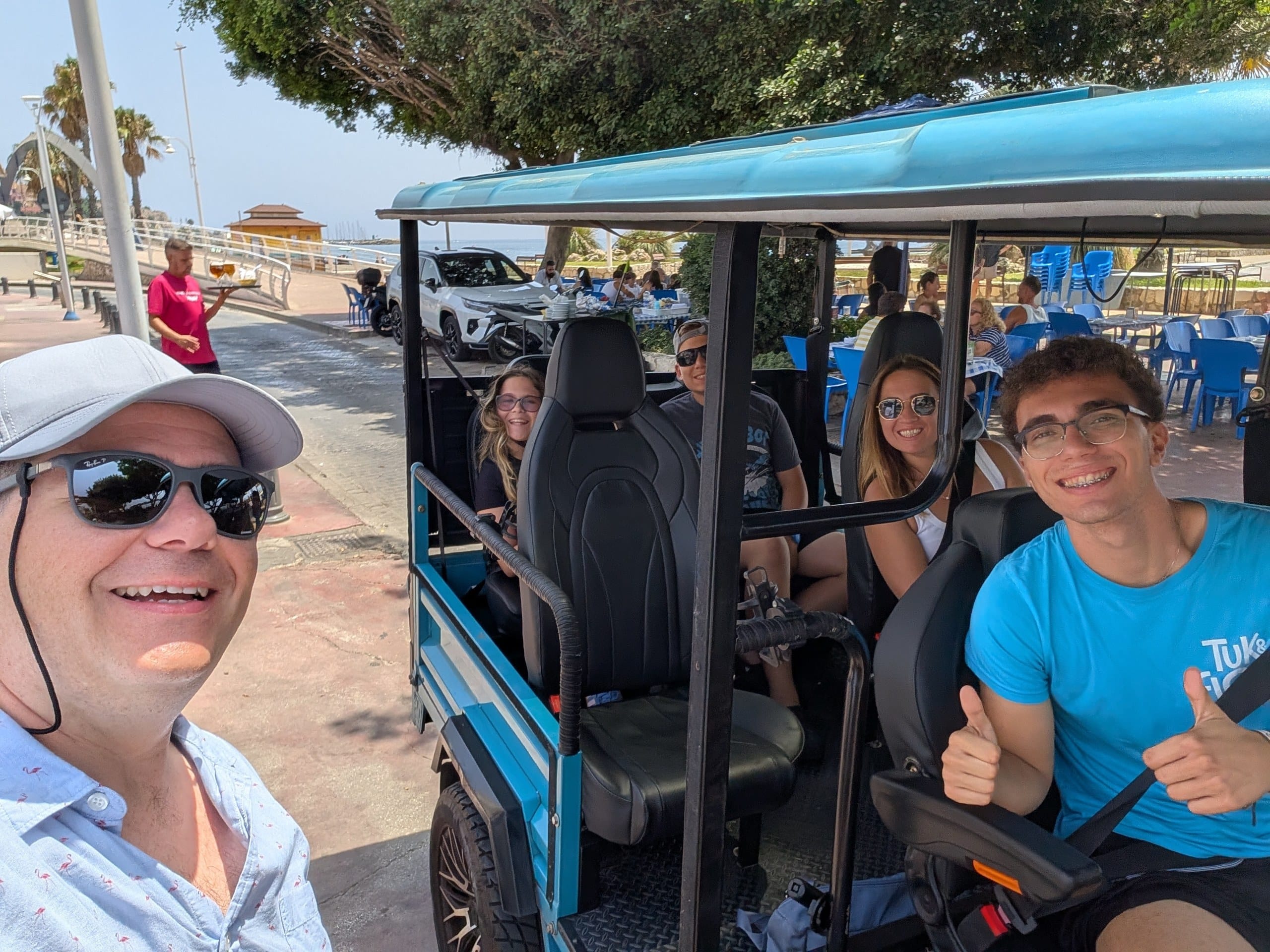 Alex and family in the Tuk and Flow tuk tuk with guide David in Malaga