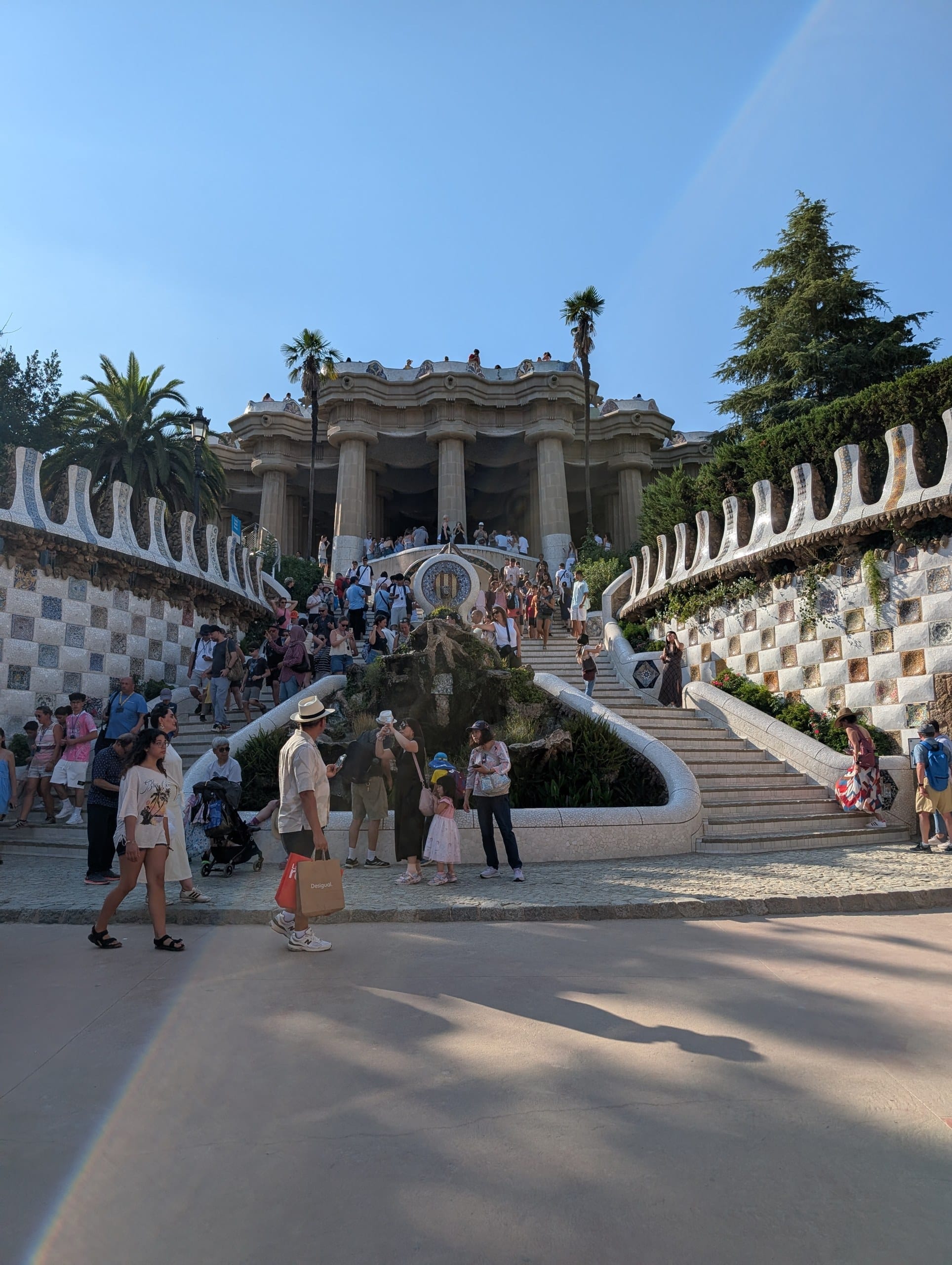 Crowds on the dragon staircase at the main Park Guell entrance