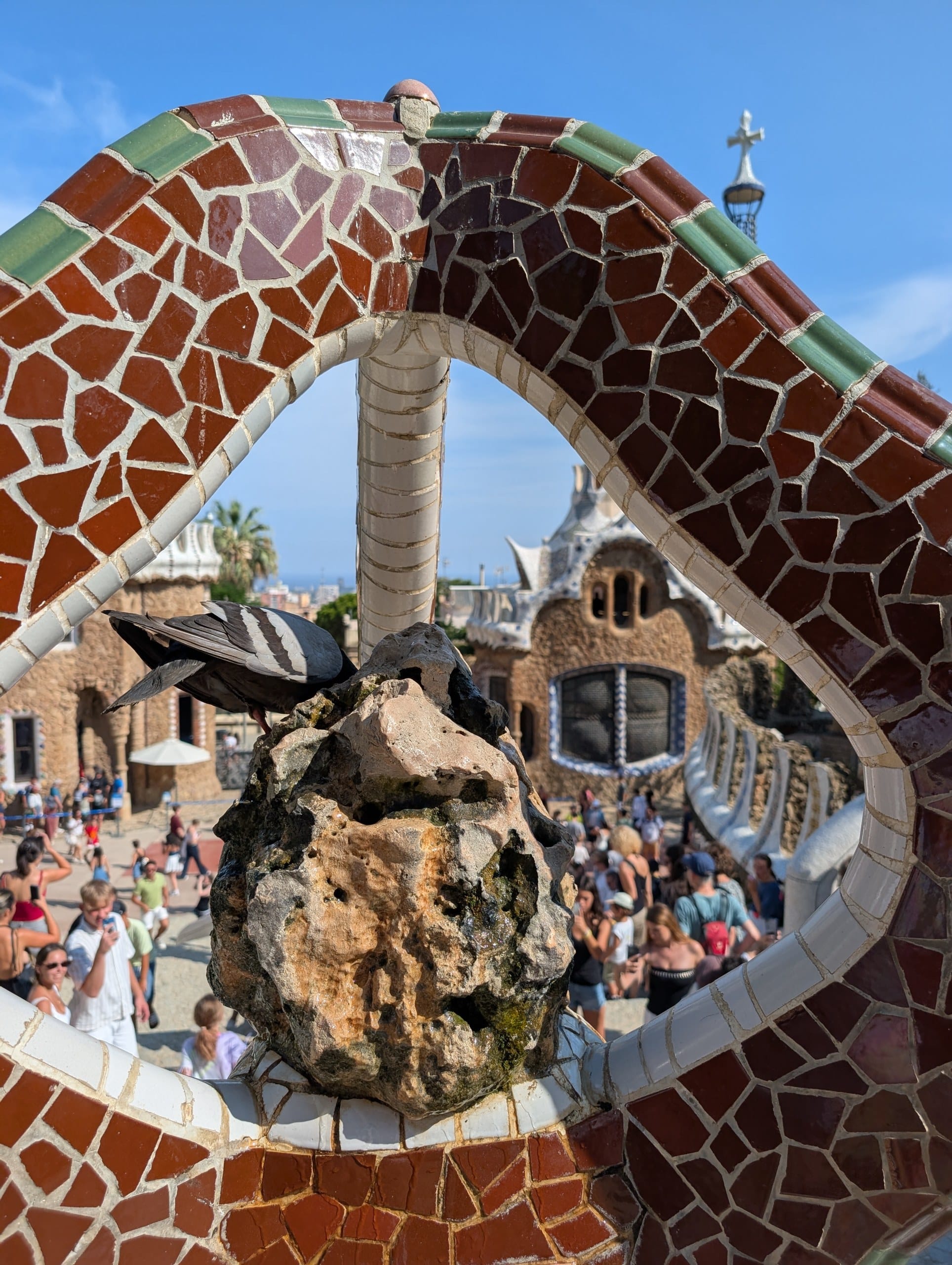 Visitors on Nature Square at Park Guell in the late afternoon