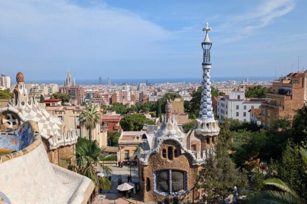 The view over the Park Guell gatehouses to Barcelona and the sea