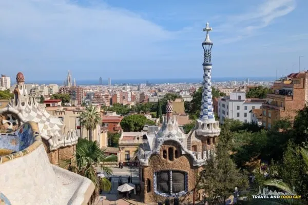 The view over the Park Guell gatehouses to Barcelona and the sea