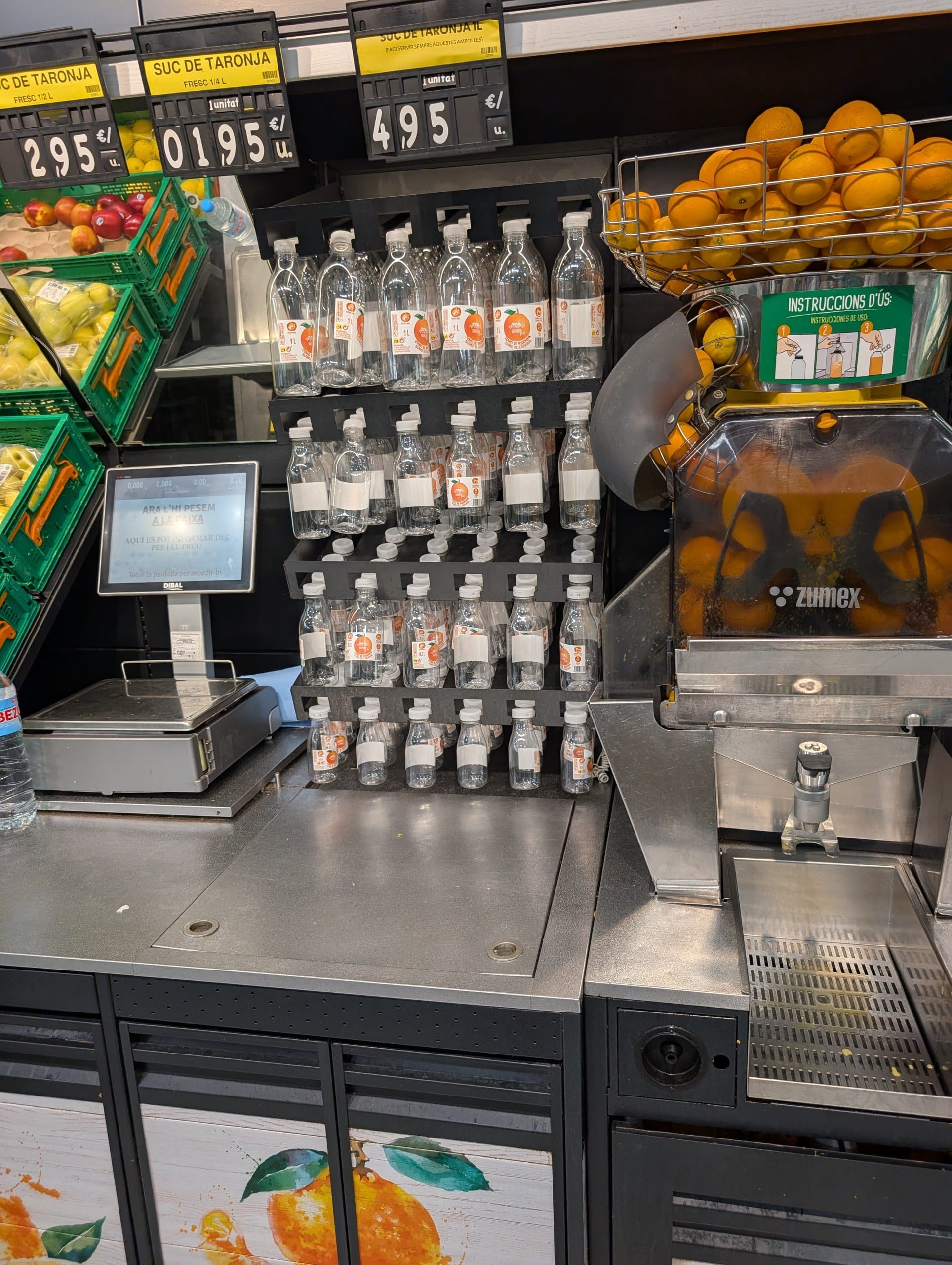 The self service Zumex orange juice press at a Condis supermarket in Poblenou, Barcelona