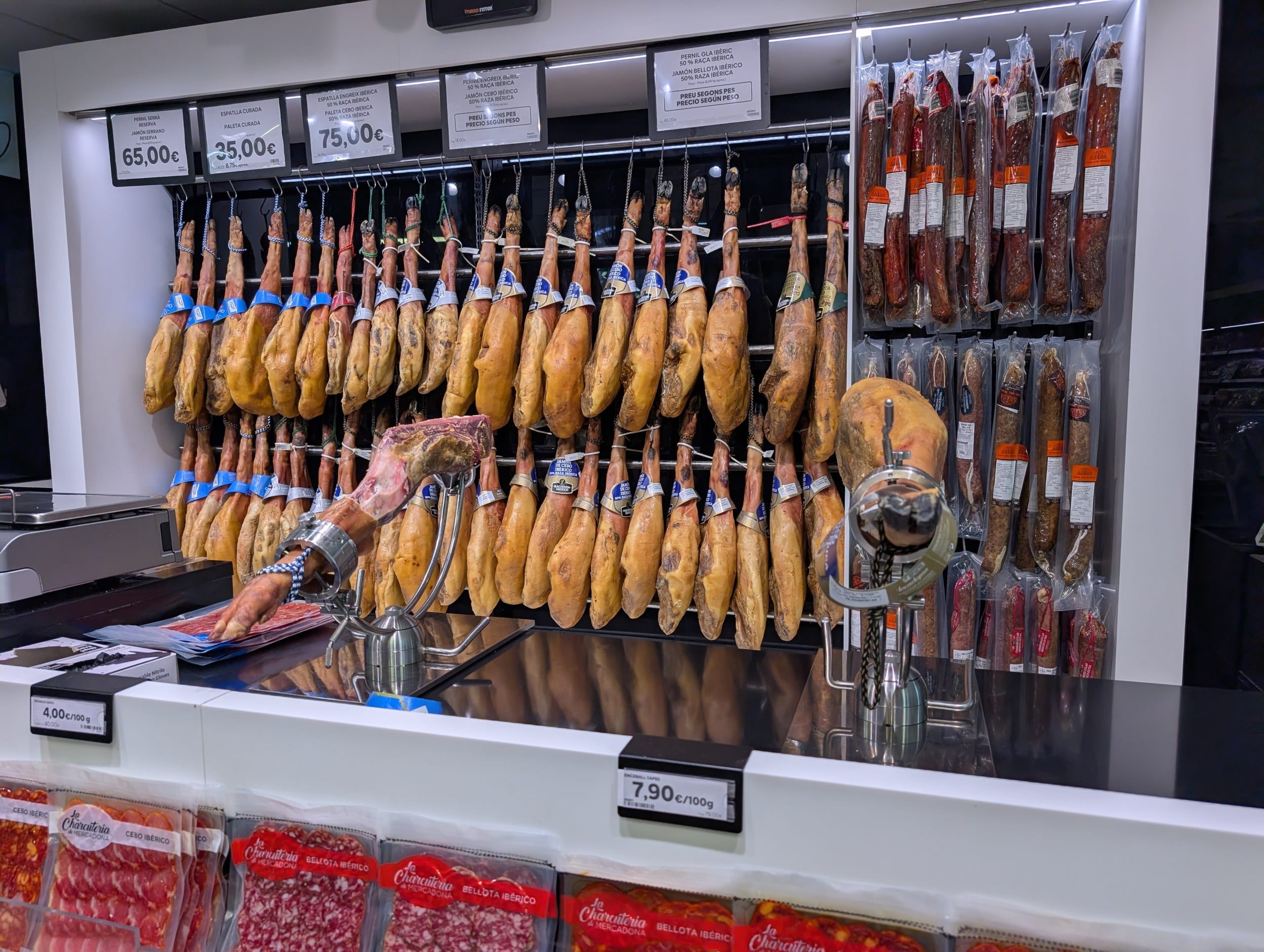 The jamon and charcuterie counter at a Condis supermarket in Poblenou, Barcelona