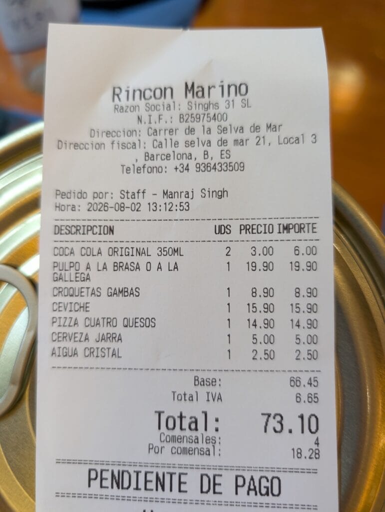 The itemized bill from Rincón Marino showing a total of 73.10 euros for four diners