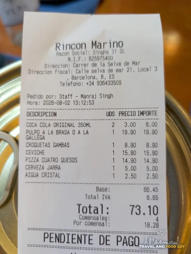 The itemized bill from Rincón Marino showing a total of 73.10 euros for four diners
