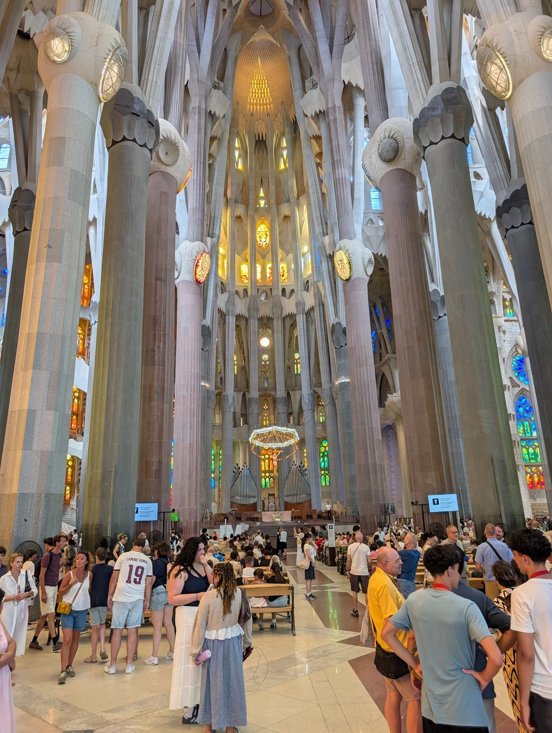 The central nave of the Sagrada Familia looking toward the altar