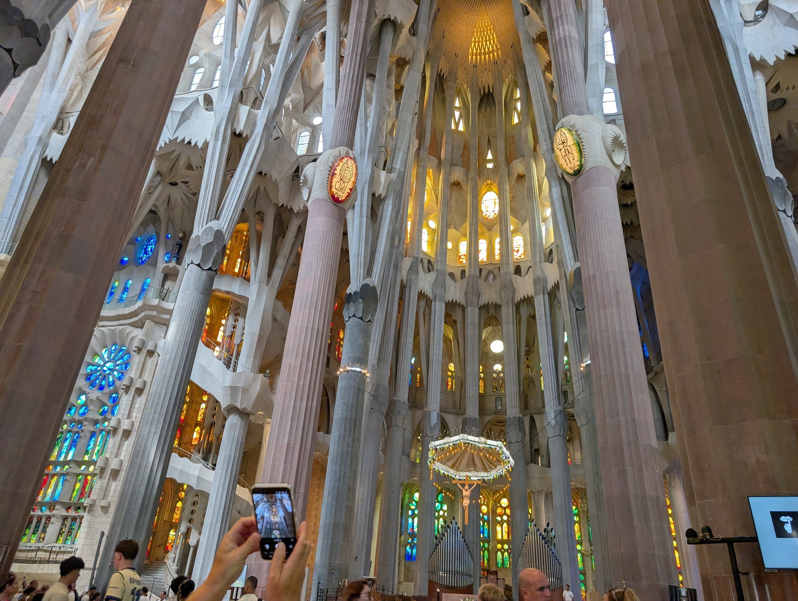 Golden light through the upper windows of the Sagrada Familia nave