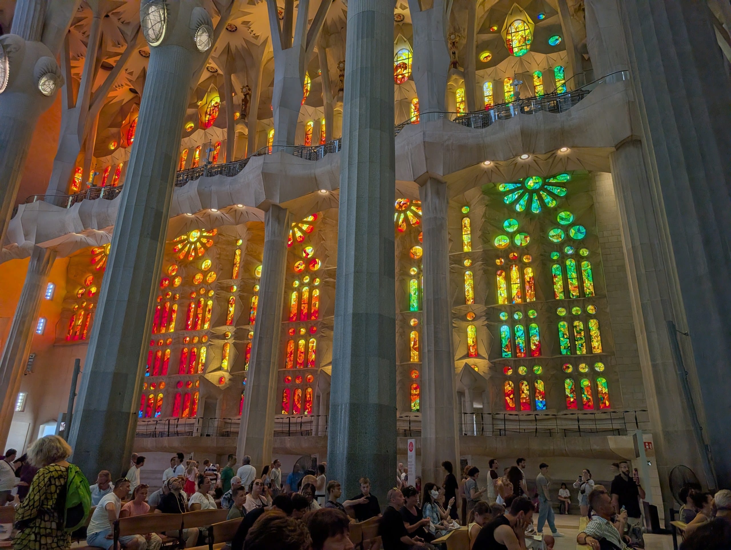 Warm red and orange stained glass on the Passion side of the Sagrada Familia
