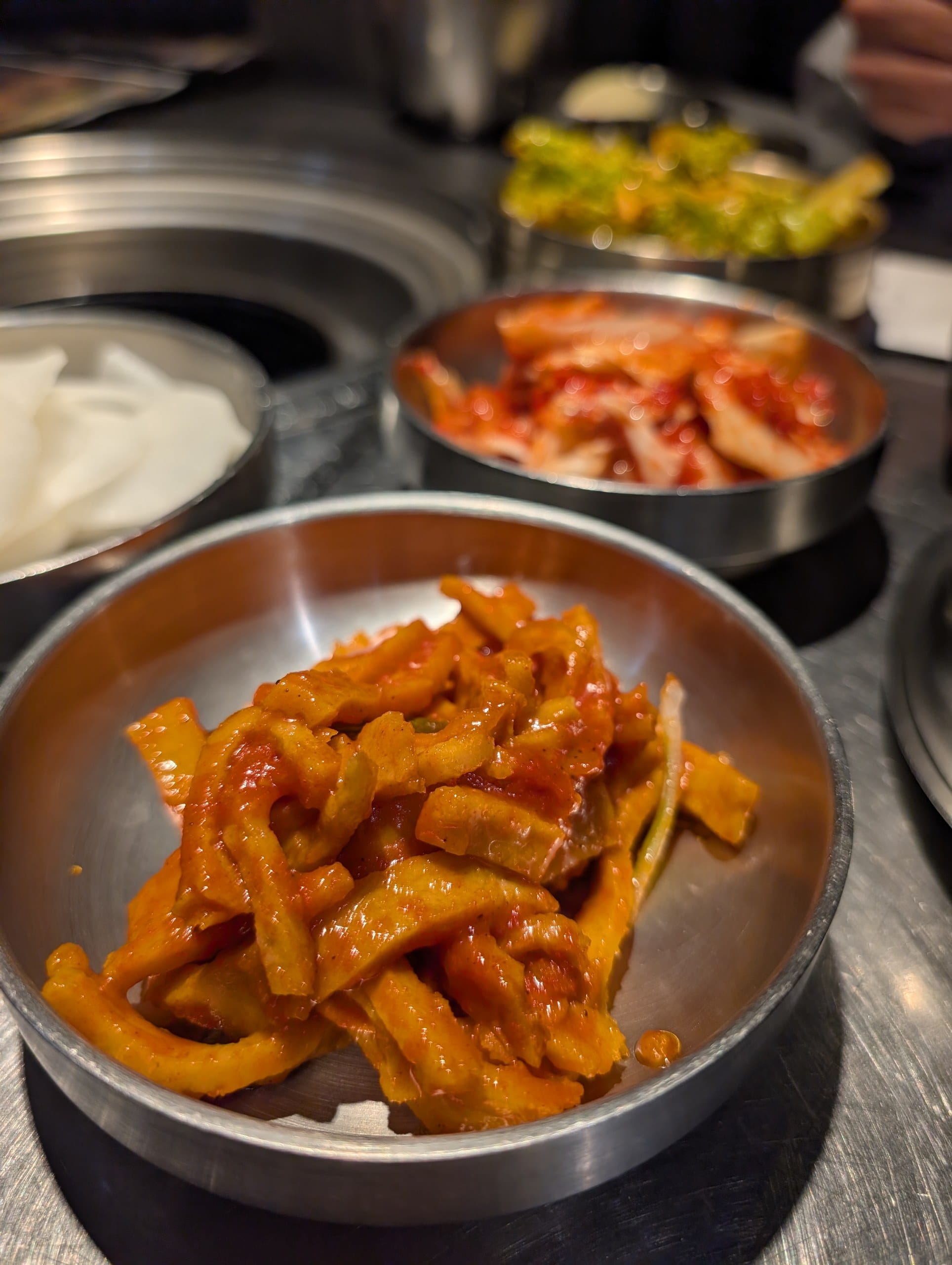 Banchan at Tanjong Hwaro, spicy pickled radish and kimchi