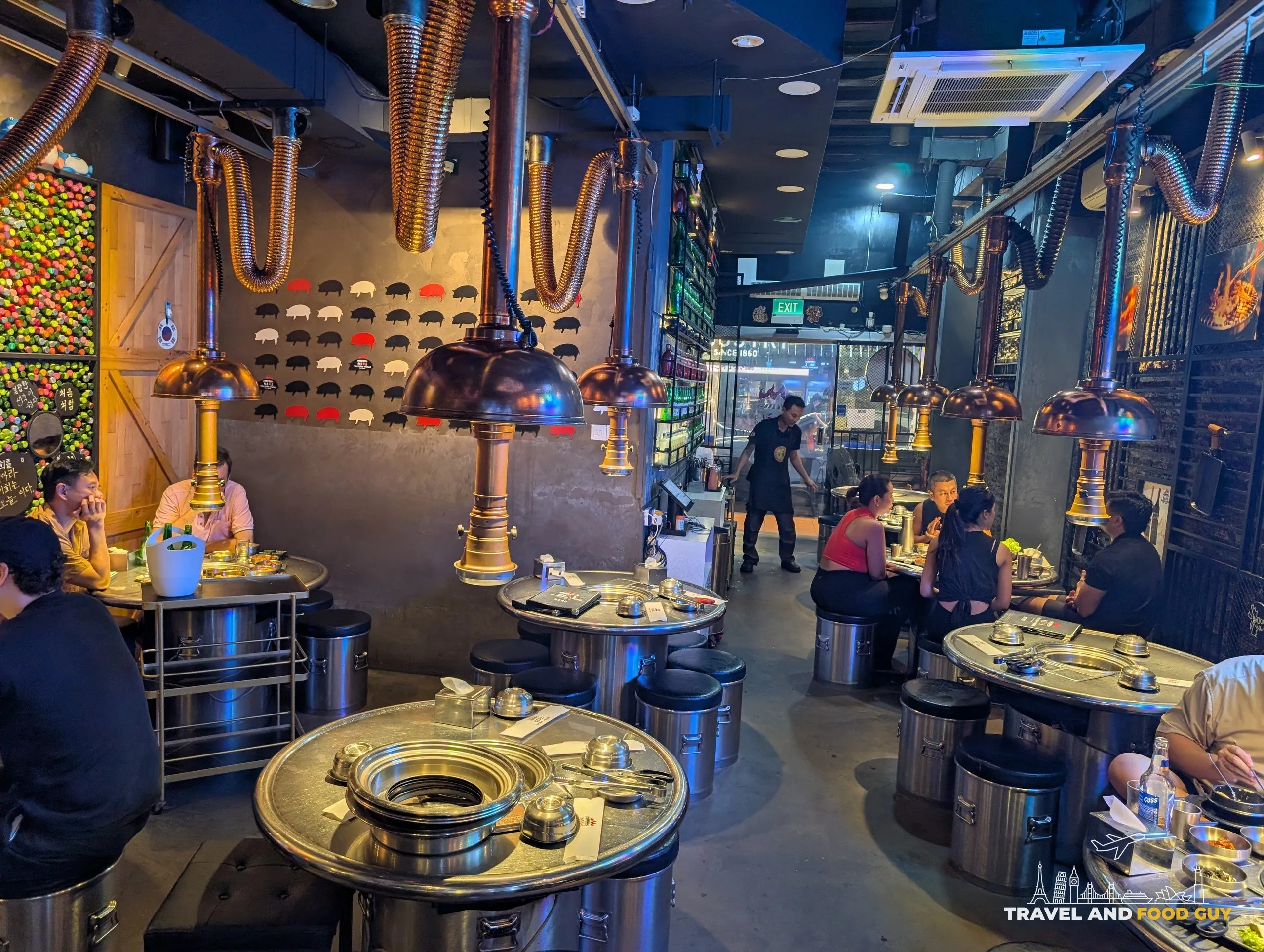 Tanjong Hwaro during service, copper hoods and staff working the room