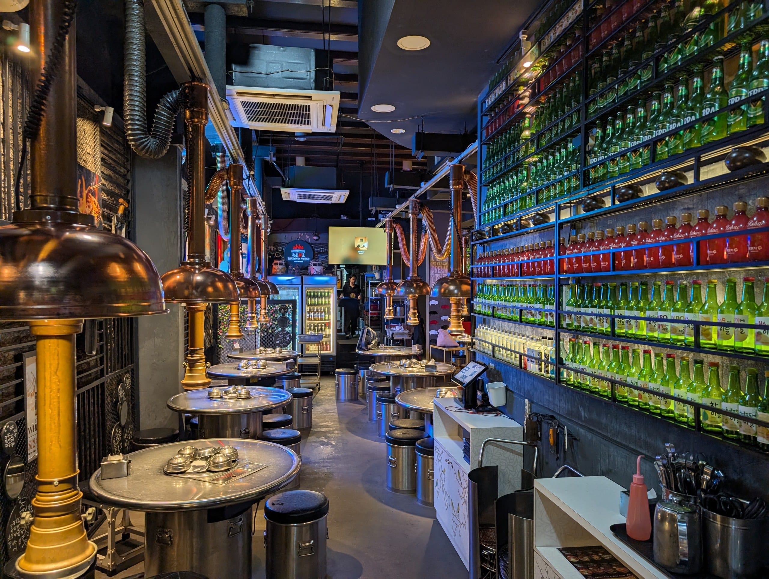 Wall of soju and beer bottles at Tanjong Hwaro