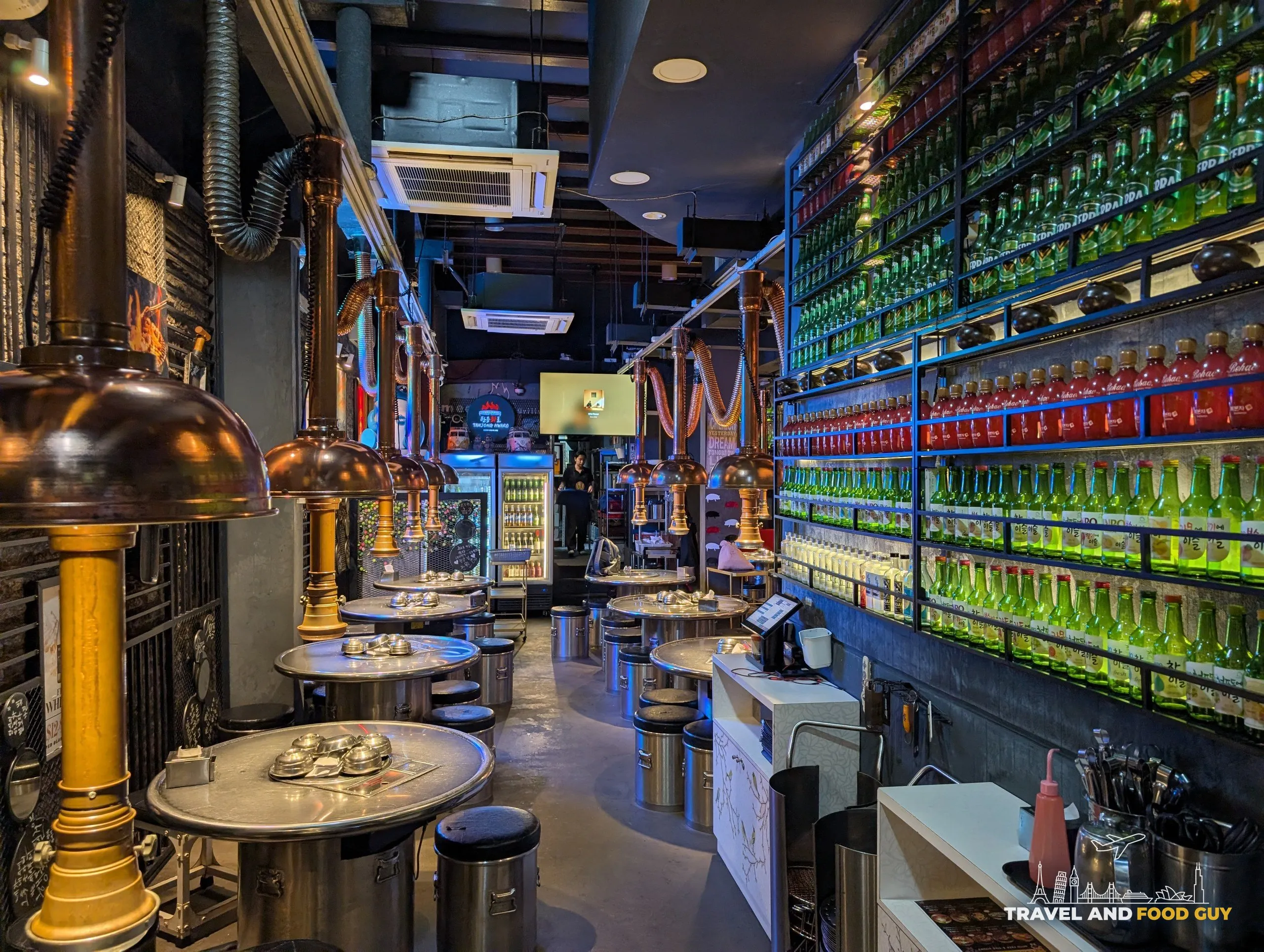 Wall of soju and beer bottles at Tanjong Hwaro