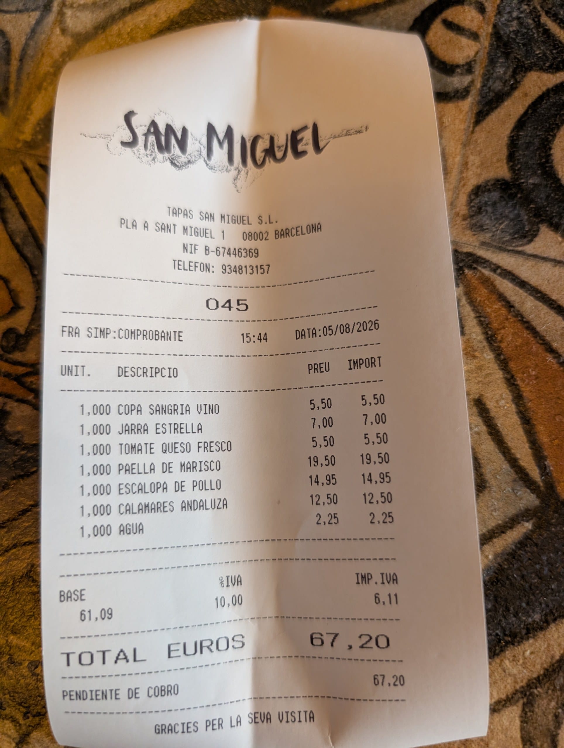 Ticket 045 from Tapas San Miguel in Barcelona showing seven line items, base 61,09, IVA 10 percent 6,11 and a total of 67,20 euros
