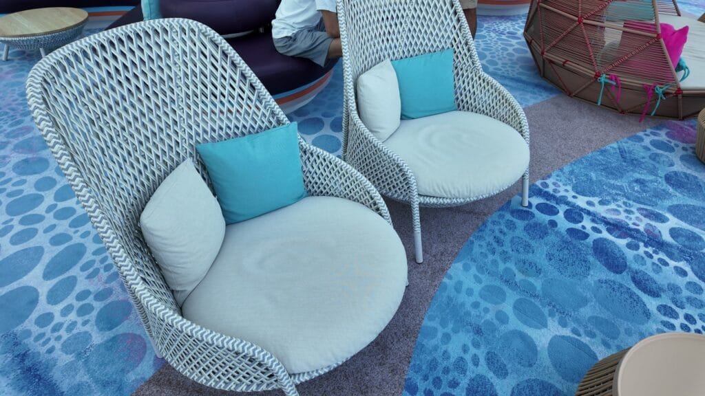 Day beds beside the pools on Chill Island, Legend of the Seas
