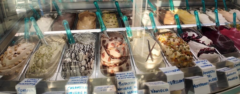 Gelato display case in Civitavecchia with handwritten flavor cards