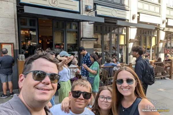 Alex, Vika, Josh and Emily taking a selfie outside Dishoom Covent Garden on Upper St. Martin's Lane.