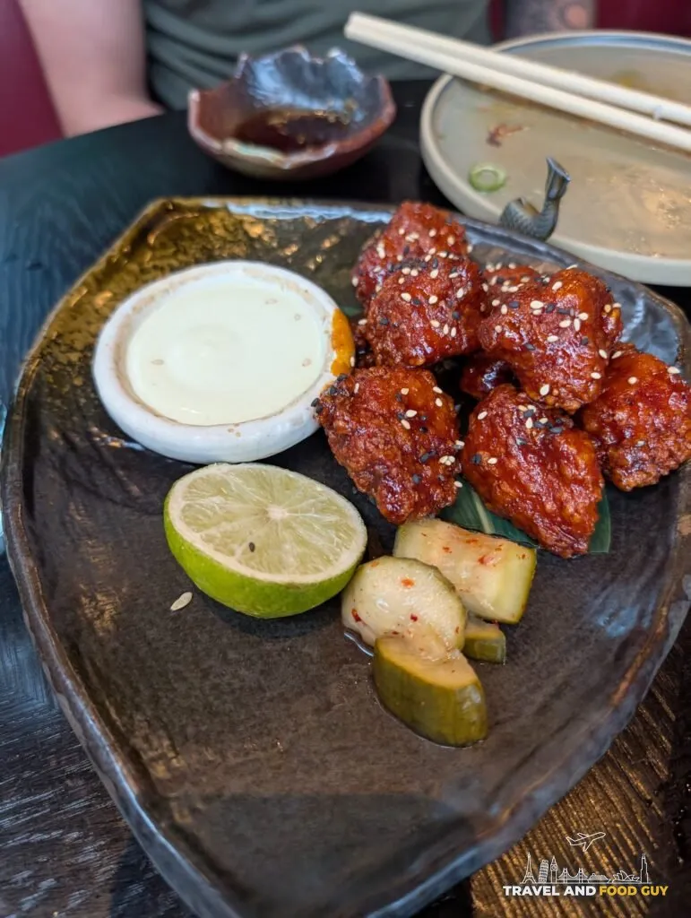 Gochujang glazed chicken with sesame, a creamy dip, lime and pickles at The Ivy Asia St Paul's.