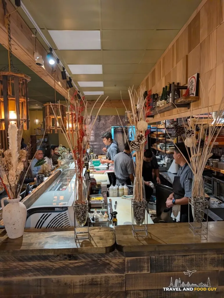 A long view down Kaido's sushi bar from the front of the room.