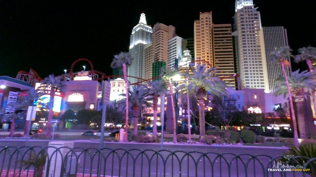 New York New York in Las Vegas at night with the roller coaster in front of the skyline
