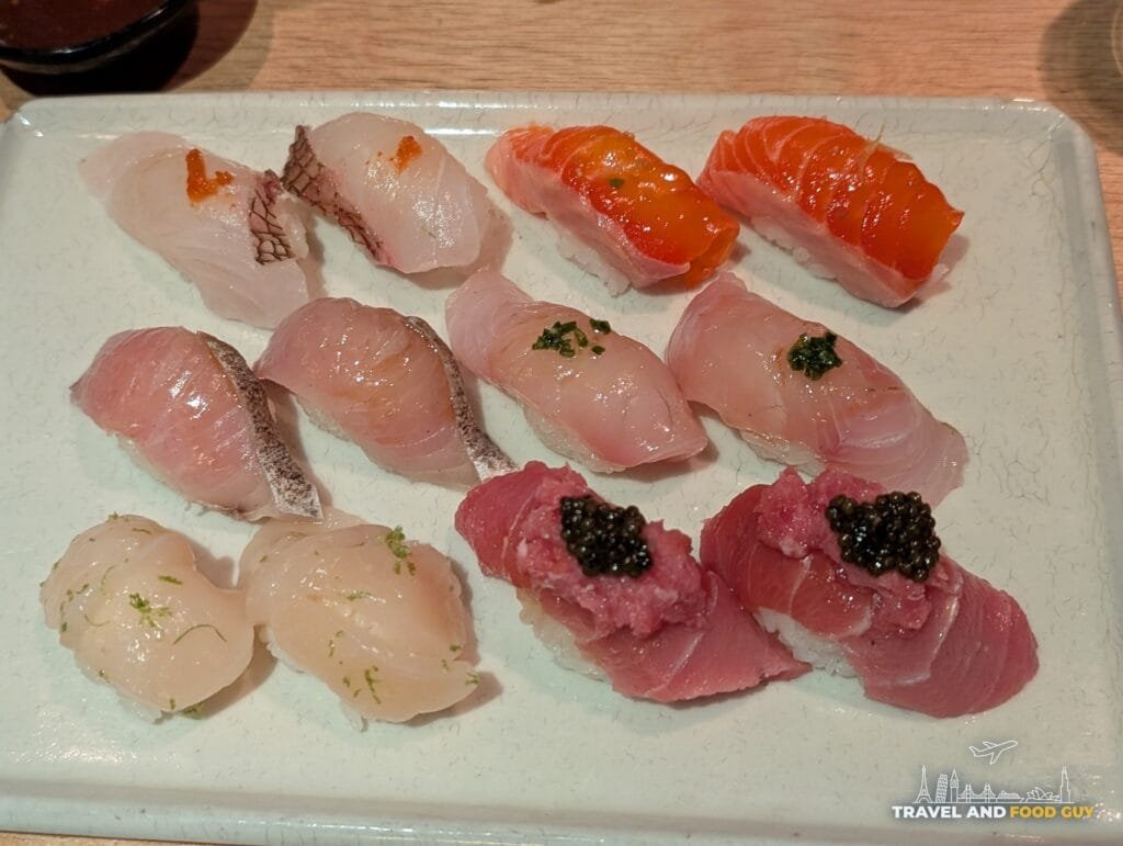 Sushi-San's D-Luxe Nigiri, twelve pieces across six fish including red snapper, scallop and fatty tuna topped with chopped toro and osetra caviar.