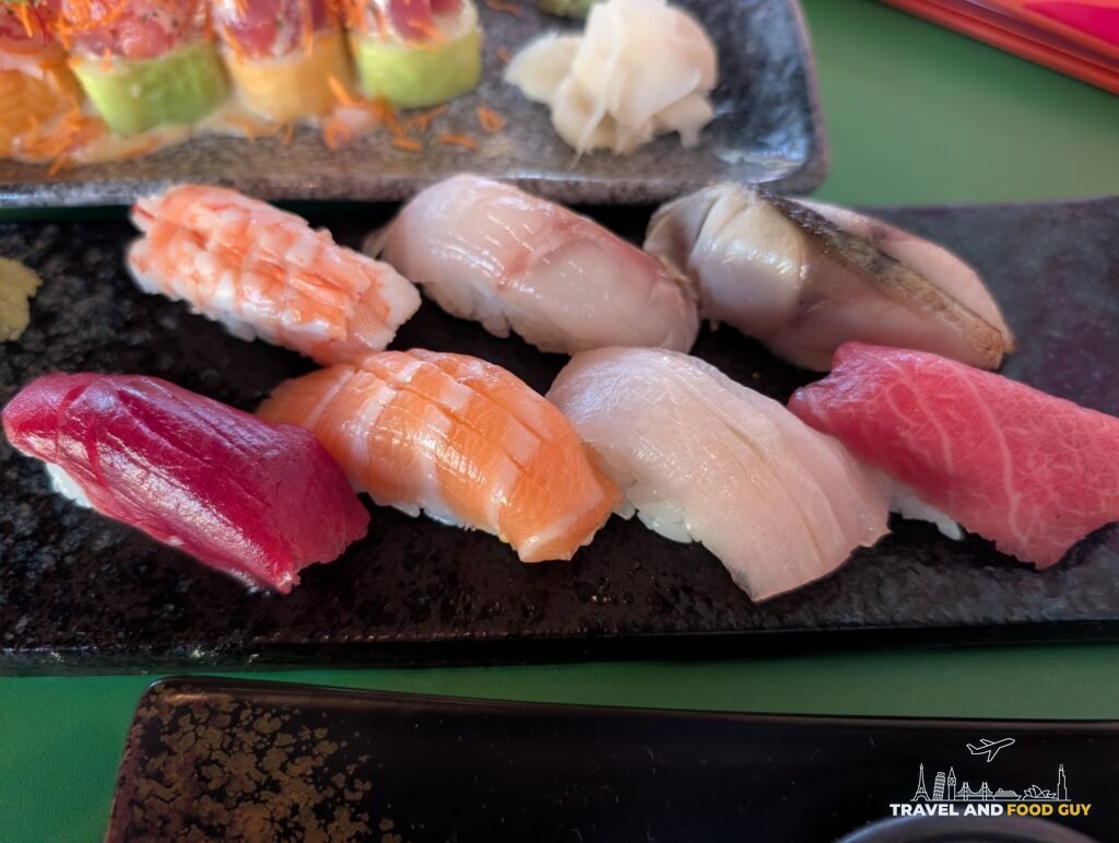 Seven pieces of nigiri at SUSHISAMBA London, including fatty tuna, salmon and shrimp.