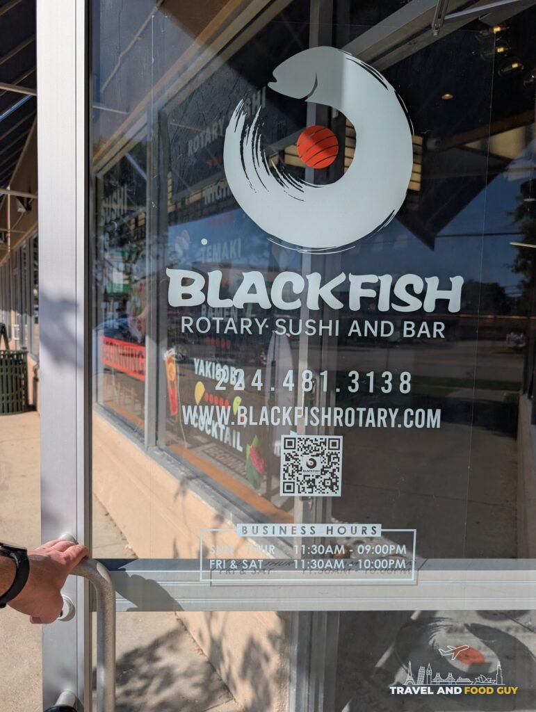 The Blackfish front door with the phone number, website, a QR code and the business hours.