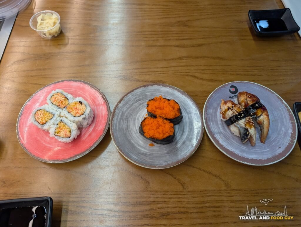 Three belt plates on our table at Blackfish: a spicy salmon roll, masago gunkan and eel nigiri.