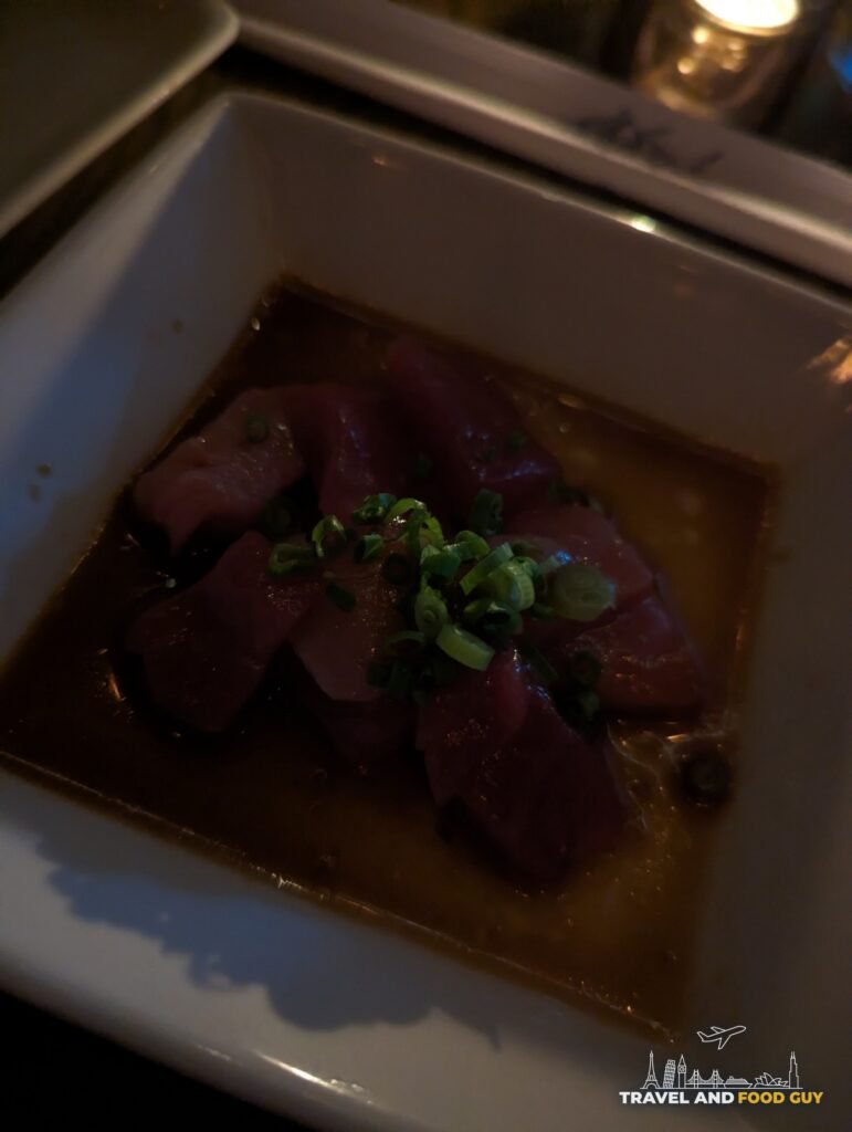 Tuna sashimi in ponzu with chives, the first course of the Trust Me at SUGARFISH Beverly Hills.