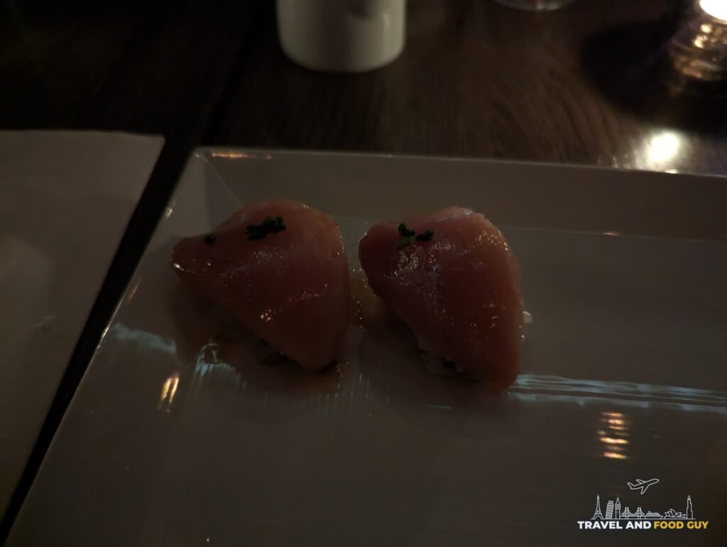 Two pieces of albacore nigiri with ponzu and chives at SUGARFISH Beverly Hills.